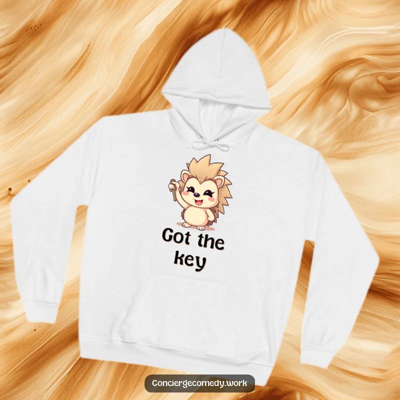 Funny cheerful hedgehog hoodie holding a key, gleaming smile, cozy and optimistic apparel.