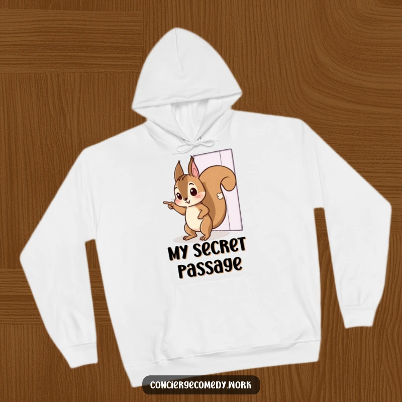Funny hoodie with a curious squirrel character tiptoeing, pointing towards an invisible door. Cozy and imaginative apparel.